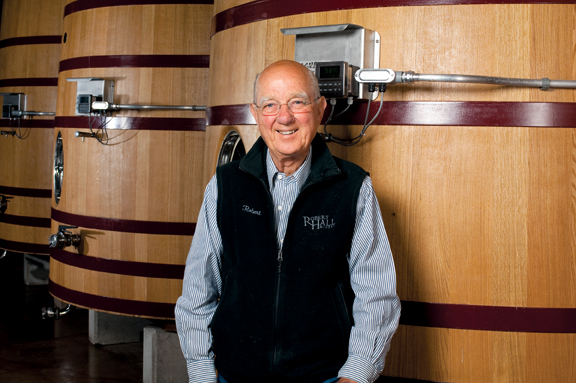 Owner Robert Hall by some fermentation tanks.