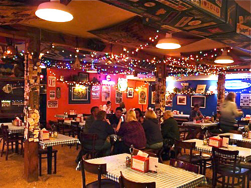 The interior of Klondike Pizza takes you straight to Alaska, with endless displays of artifacts and a unique decor.