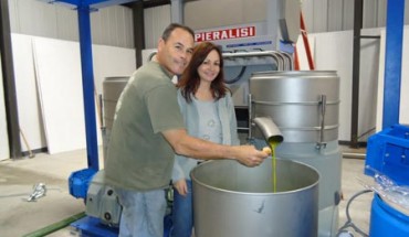 Owners making olive oil